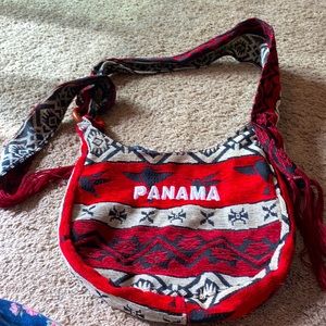 Made in Panama!  NWOT. Has zipper top and zipper pocket.  Red tassels!
